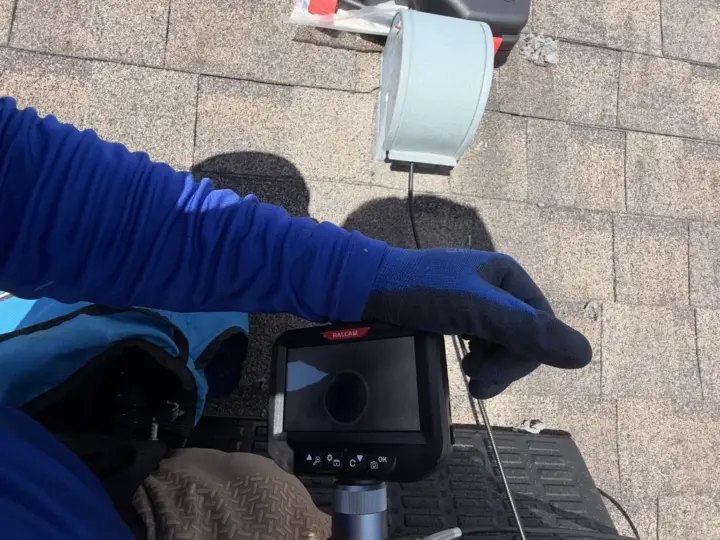 Checking a dryer vent exit on the roof with an inspection camera (South Tampa)