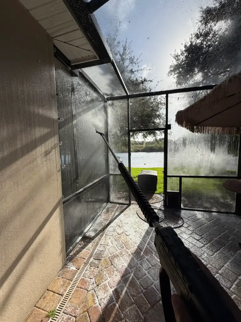 Soft washing the pool cage screens at low pressure in Safety Harbor, FL