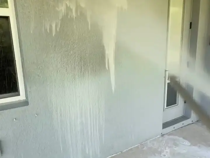 Soft washing a porch wall in Riverview