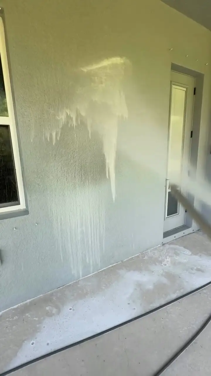 Soft washing a porch wall in Riverview