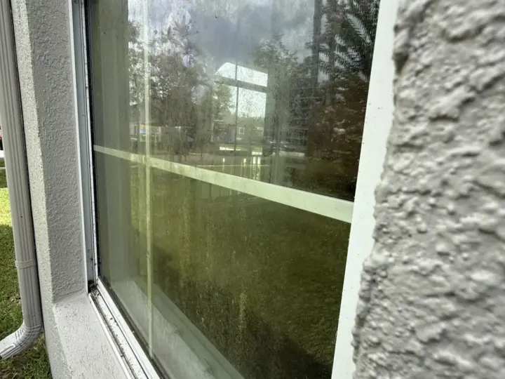 Window with water spots and grime, before cleaning (New Tampa)